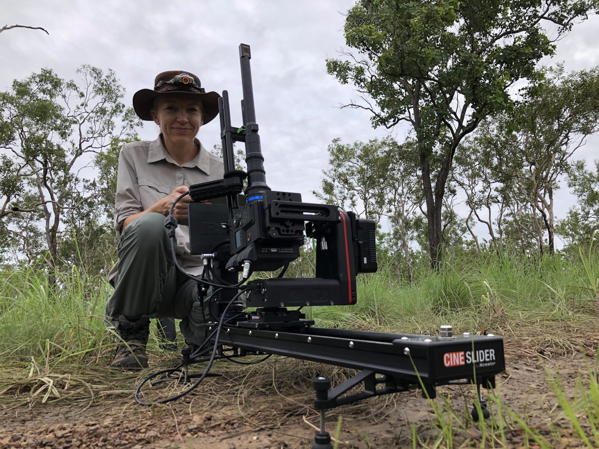 Della Golding operating a Cine Slider camera rig in Northern Territory savanna