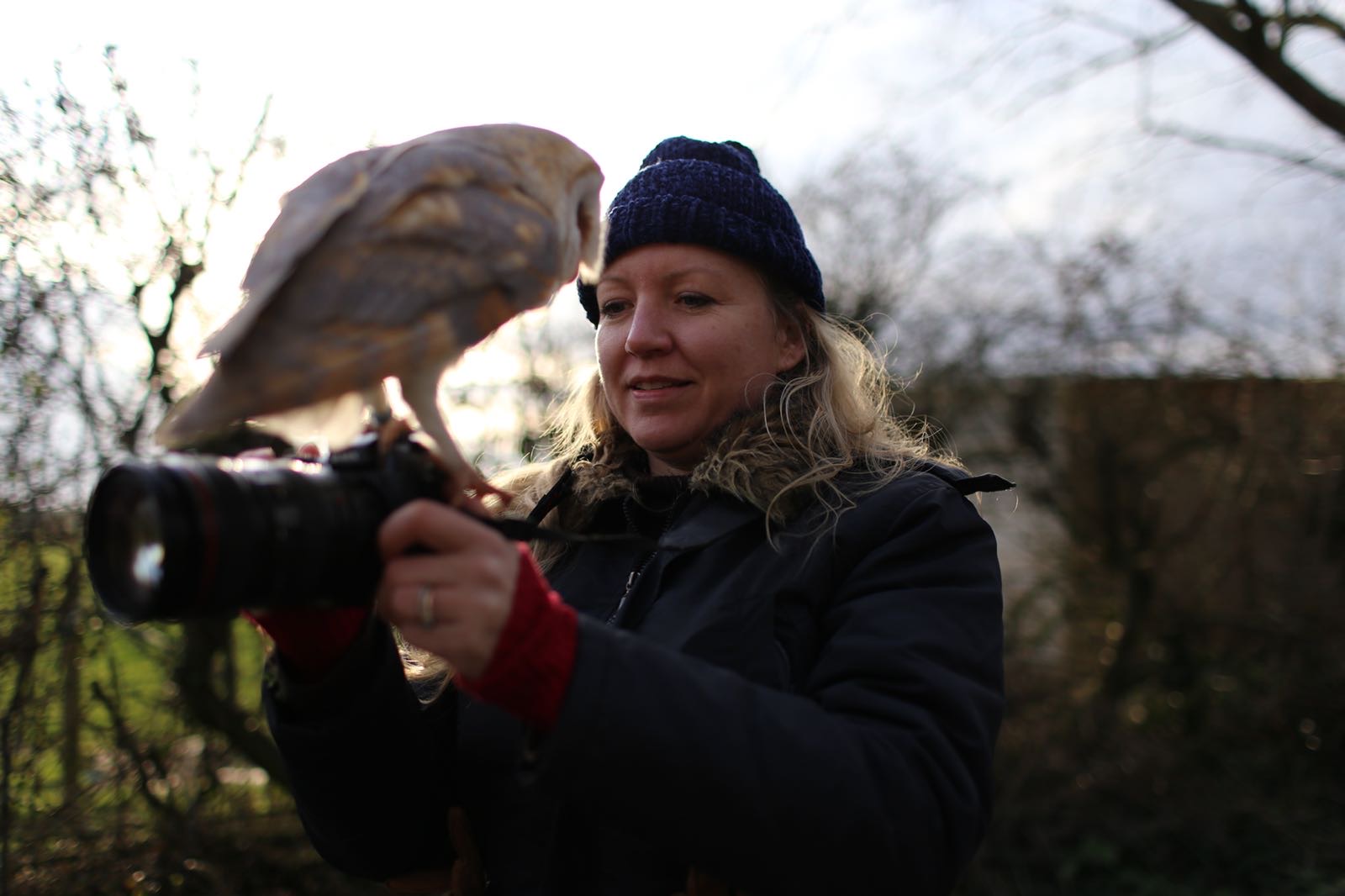 Della Golding with a barn owl on her camera during a wildlife shoot
